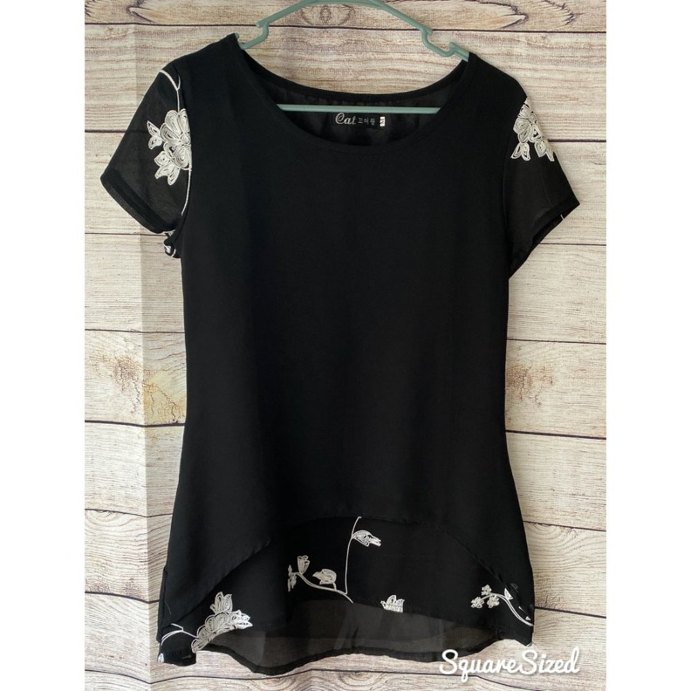 Black tunic blouse white embroidered floral detail women’s size medium elegant